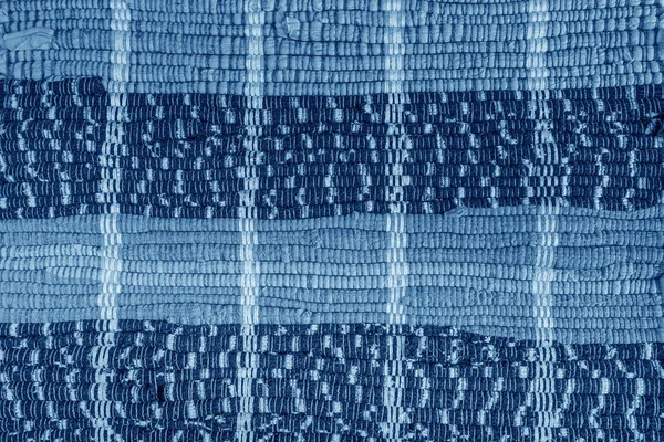 Hintergrund, Textur des farbigen handgefertigten Teppichs. — Stockfoto
