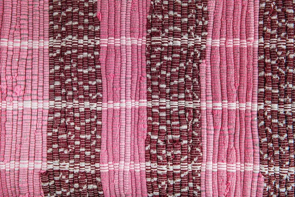Bakgrund, textur av färgad handgjord matta. — Stockfoto