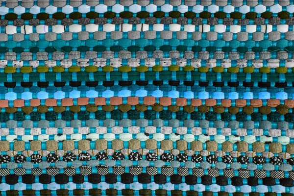 Hintergrund, Textur des farbigen handgefertigten Teppichs — Stockfoto