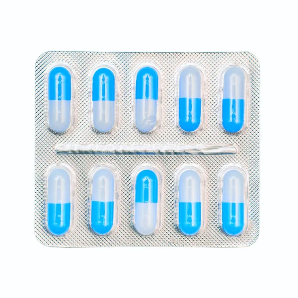 Embalagem blister de cápsulas azuis e brancas isoladas em branco — Fotografia de Stock