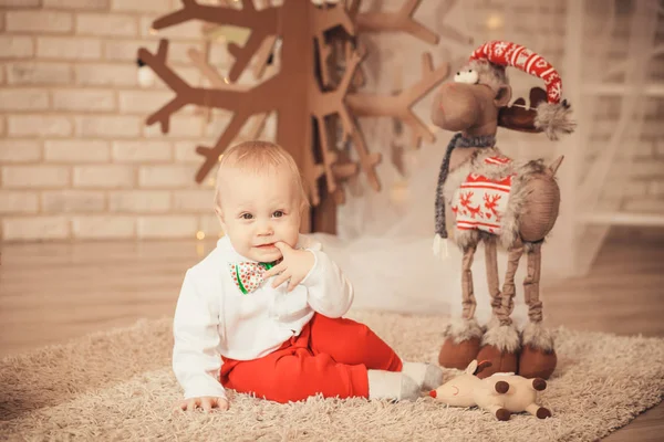 Cute little baby boy among Christmas decorations — Stock Photo, Image