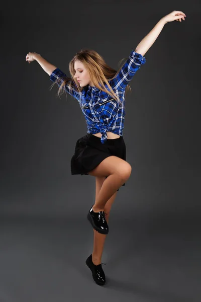 Pretty modern slim hip-hop style teenage girl jumping on — стоковое фото