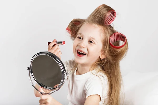 Fashion baby girl is doing makeup and having fun — Stock Photo, Image