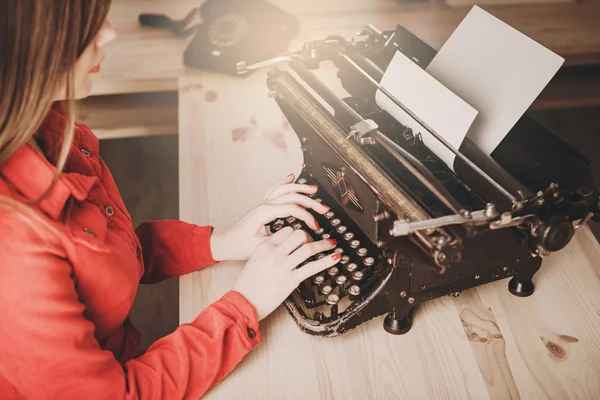 Young woman using typewriter, business concepts, retro picture s