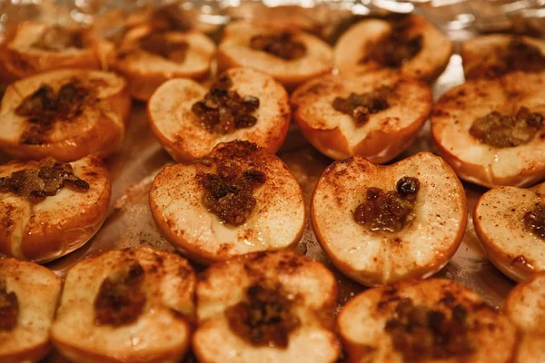 baked halves of apples with honey, cinnamon and raisins