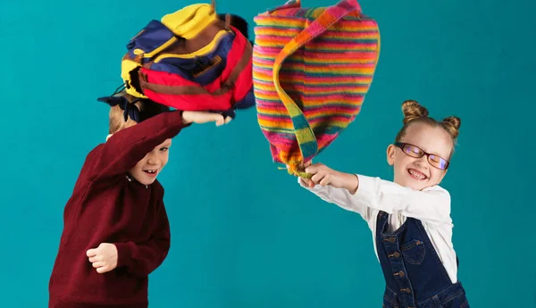 Funny little kids with big backpack jumping and having fun again — Stock Photo, Image