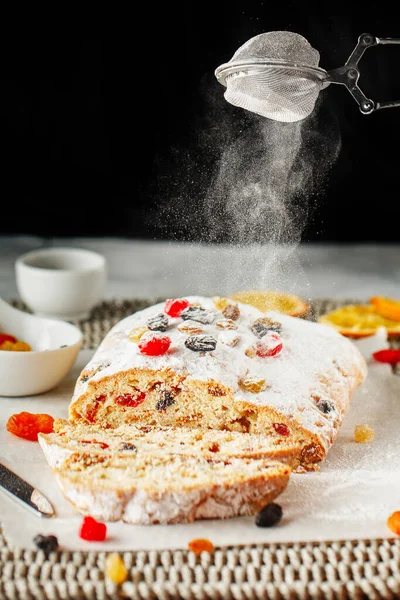 Holiday baking. Christmas cake. Stollen is fruit bread of nuts,