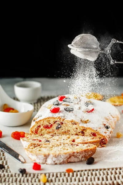 Holiday baking. Christmas cake. Stollen is fruit bread of nuts,