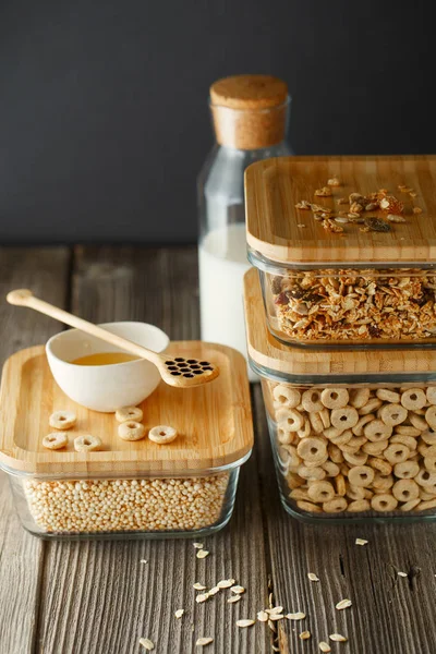 Breakfast cereal. Glass boxes with granola, cereal rings and Qui