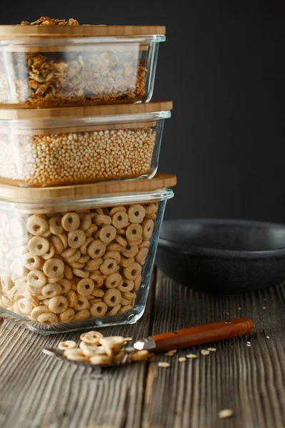 Breakfast cereal. Glass boxes with granola, cereal rings and Qui