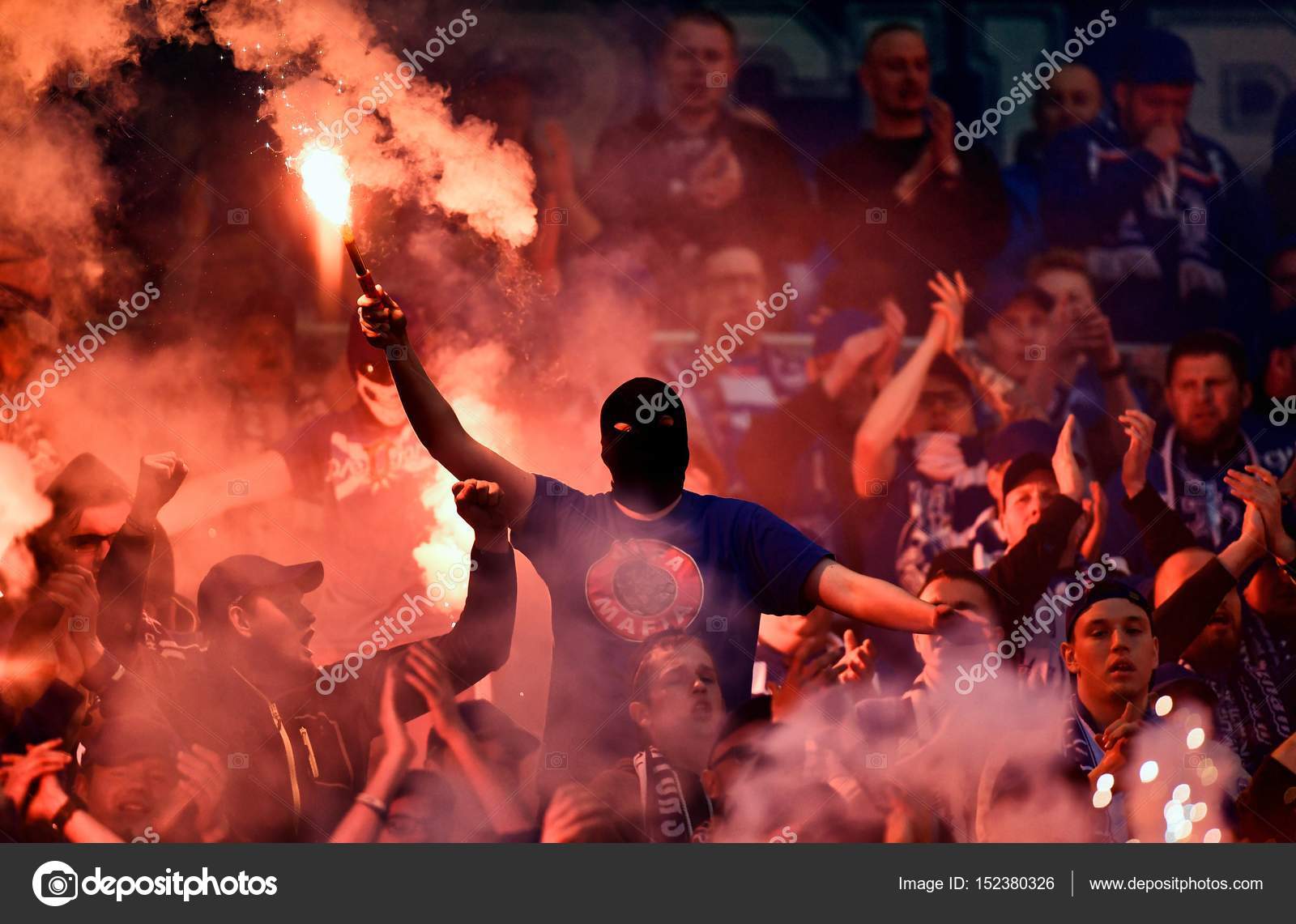 Football supporters with flares Stock Editorial Photo © mgillert
