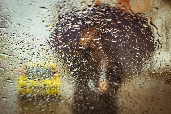 A blurry silhouette with umbrella — Stock Photo, Image