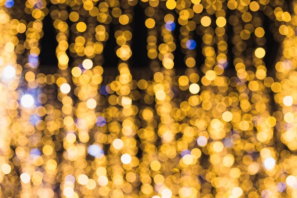 Defocused glittering background of golden garland  lights. Abstr — 스톡 사진