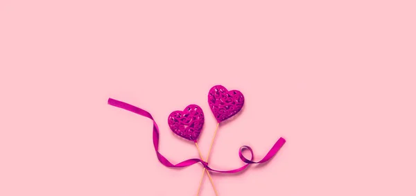 Abstract composition with two decorative hearts with ribbon on p — Stock Photo, Image