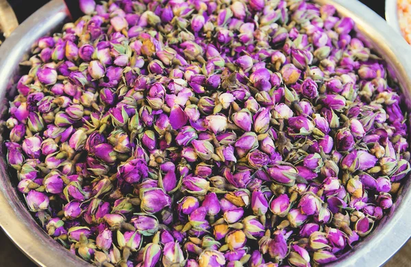 Dried rose buds close up at the market. Aromatherapy concept. Selective focus