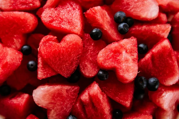 Pezzi di anguria e cuori — Foto Stock