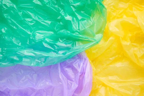 Close up Texture di un sacchetto multicolore di plastica spazzatura. Poli verde — Foto Stock