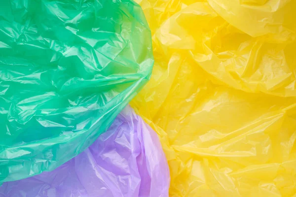 Close up Texture di un sacchetto multicolore di plastica spazzatura. Poli verde — Foto Stock