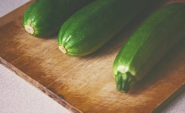 Close view zucchini on wooden surface — Stock Photo, Image