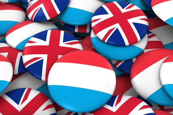 Insignias de Luxemburgo y Reino Unido Antecedentes - Montón de botones de bandera luxemburguesa y británica Ilustración 3D — Foto de Stock