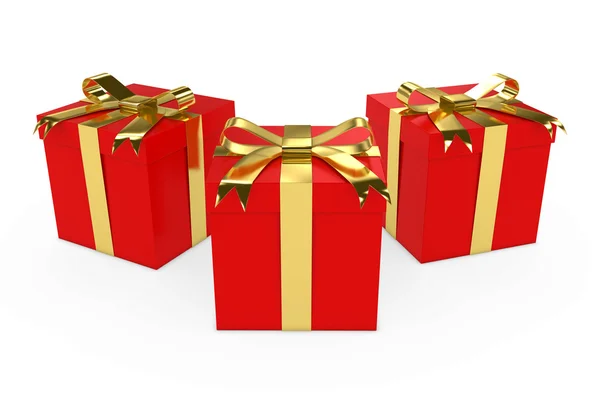 Drei rote Weihnachtsgeschenke mit goldenen Bändern auf weißem Grund — Stockfoto