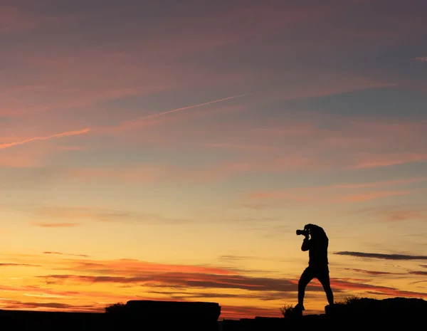 Man Standing Top Building Sun Sets Camera Take Pictures Stock Picture