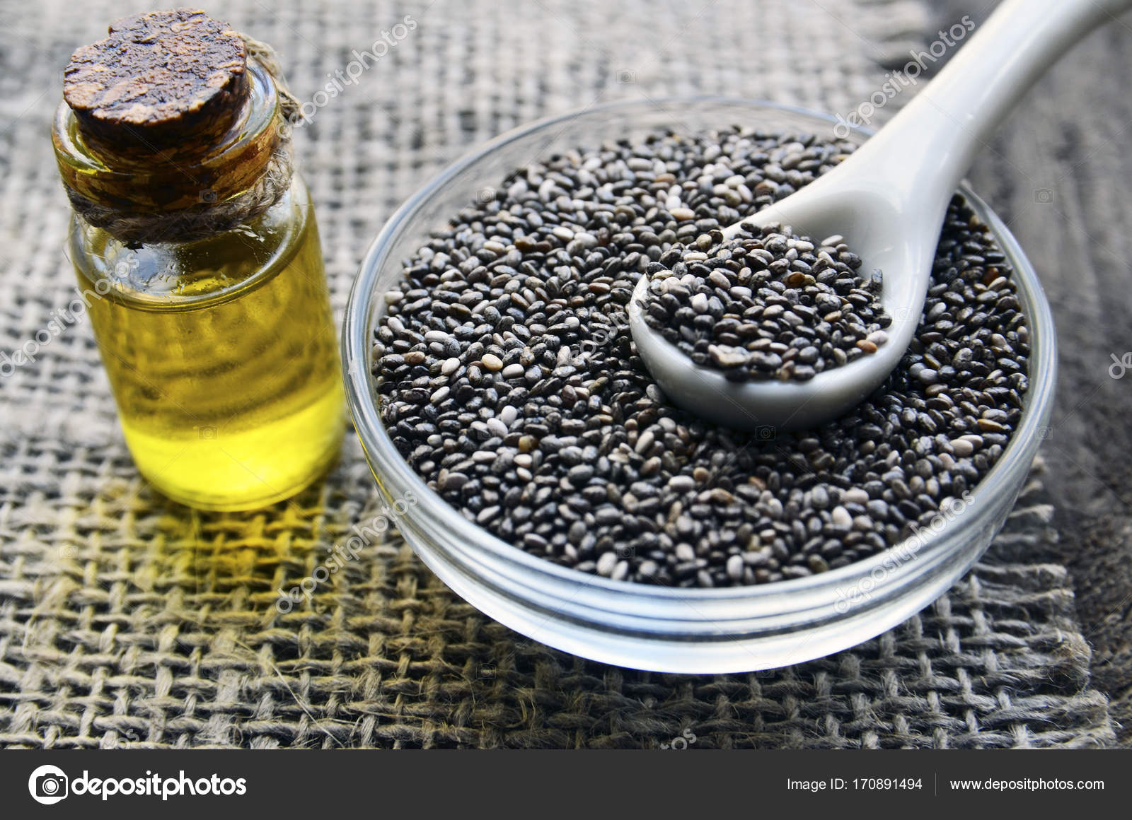 Kader Pluche pop Brood Chia seeds and chia oil on old wooden background.Organic chia seed  oil.Salvia hispanica seeds.Healthy food,superfood or bodycare concept.  Stock Photo by ©severinova 170891494