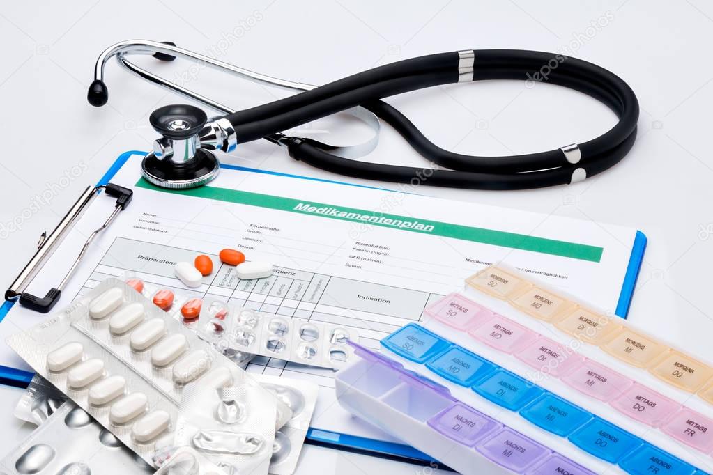 Medication plan with tablets and stethoscope