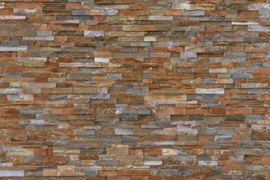 Ayrıntılı bir arka plan olarak doğal bir taş duvar