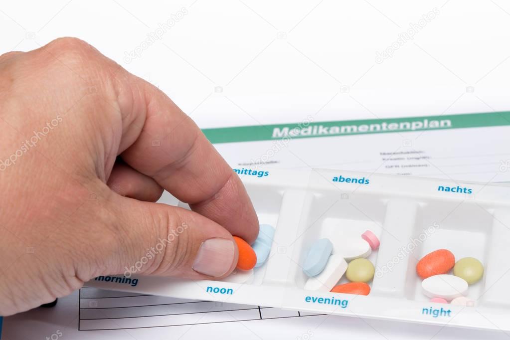 Medication plan with tablets and stethoscope