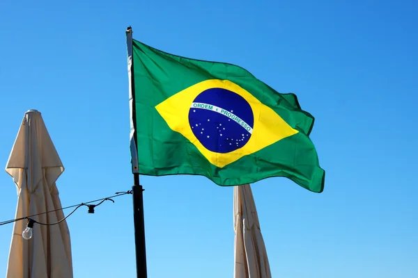 Brazil Flag and blue sky background — Stock Photo, Image