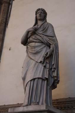 Ancient Roman sculpture of a Vestal Virgin at the Loggia dei Lanzi, Florence, Italy clipart
