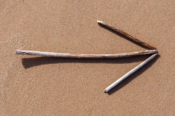 The arrow on the sand — Stock Photo, Image