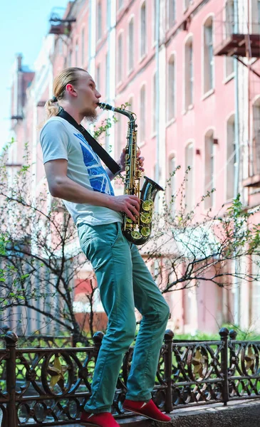Young Man Plays Sax