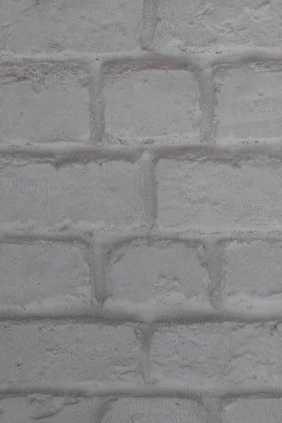 Abstract background of white brick in the masonry close-up