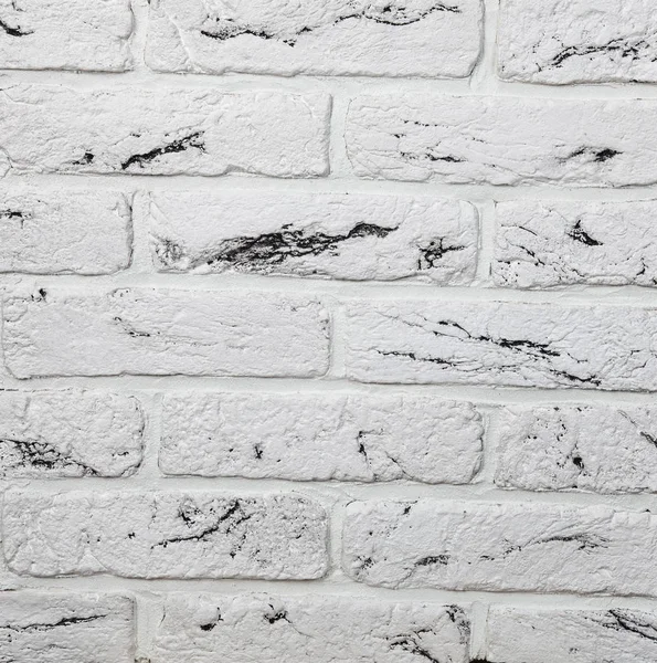Abstract background of white brick in the masonry close-up