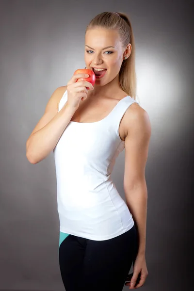Beautiful Elegant Woman Eats Apple Maintain Slim Figure Stock Image