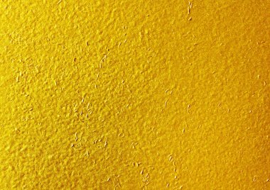 Parlak sarı yaprak altın folyo dokusu arka plan.