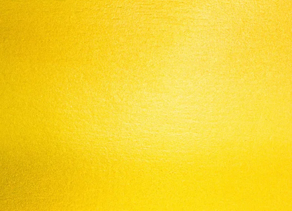 Abstrakcyjne tło. błyszczący żółty o złotej strukturze folii — Zdjęcie stockowe
