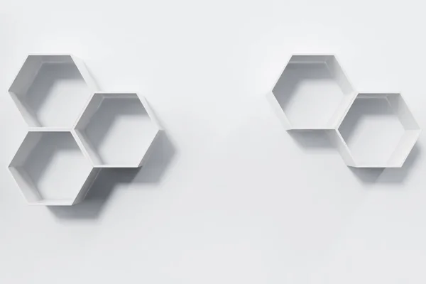 Empty white wall with hexagon shelves on the wall, 3D rendering — Stock Photo, Image