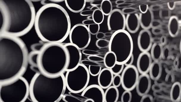 Metal pipes stacked. Heap of shiny metal steel pipes with selective focus effect. 3D animation 4k — Stock Video
