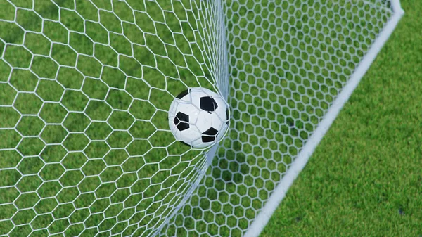 3D illustration Soccer ball flew into the goal. Soccer ball bends the net, against the background of grass. Soccer ball in goal net on grass background. A moment of delight