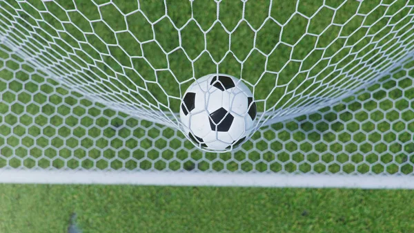 3D illustration Soccer ball flew into the goal. Soccer ball bends the net, against the background of grass. Soccer ball in goal net on grass background. A moment of delight