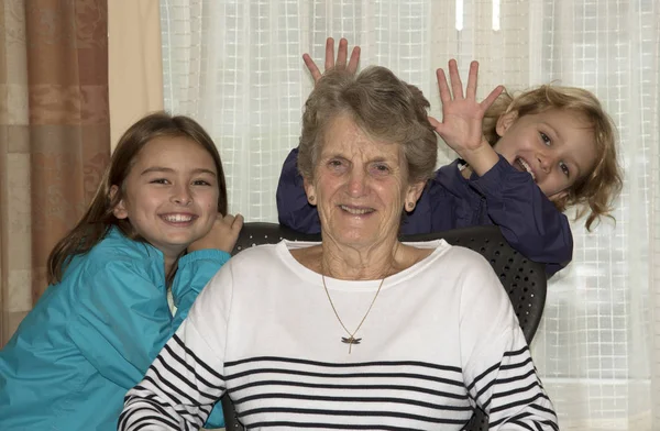 Children with grand parent — Stock Photo, Image