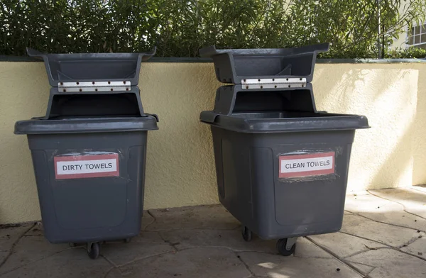 Plastic bins contains towels for swimming