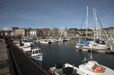 Fishing harbor and marina in the Barbican development in Plymouth Devon UK clipart