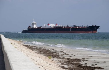 A fuel carrying barge passes Mullet Key Channel on the Gulf of Mexico clipart