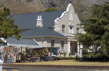 Franschhoek, Western Cape, South Africa. Dec 2019. Dutch Reform Church and tourist shop in the main street of Franschhoek a popular tourist town.