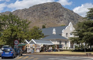 Franschhoek, Western Cape, South Africa. Dec 2019. Dutch Reform Church and tourist shop in the main street of Franschhoek a popular tourist town.