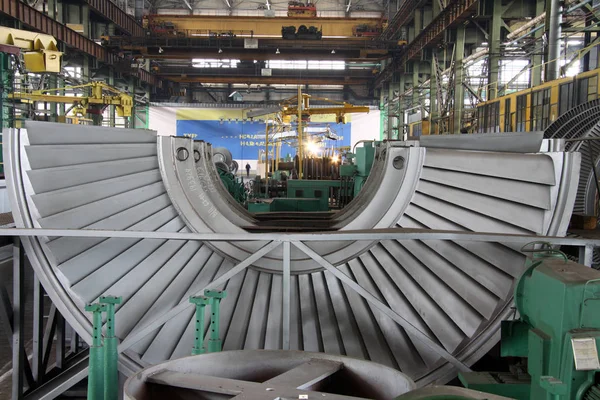 Industrial production of turbines for heavy industry. Huge steel turbine components. Industrial. Manufacture of water turbines. The huge machine turbine production. Large parts of the plant.